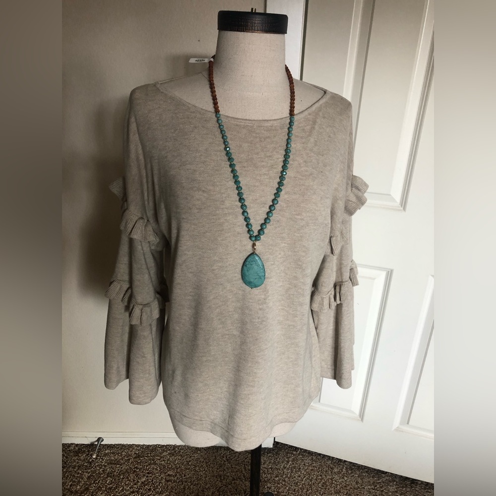 Classy versatile pullover with sleeve detail.